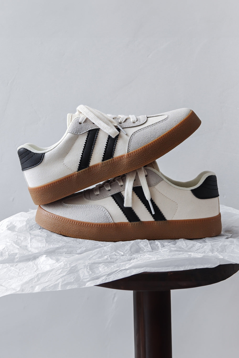 White Striped Lace Up Flat Sneakers• Stylish and versatile, these lace-up sneakers feature a chic white color with subtle stripes.
• Crafted with comfort in mind, the flat sole provides all-day suppo