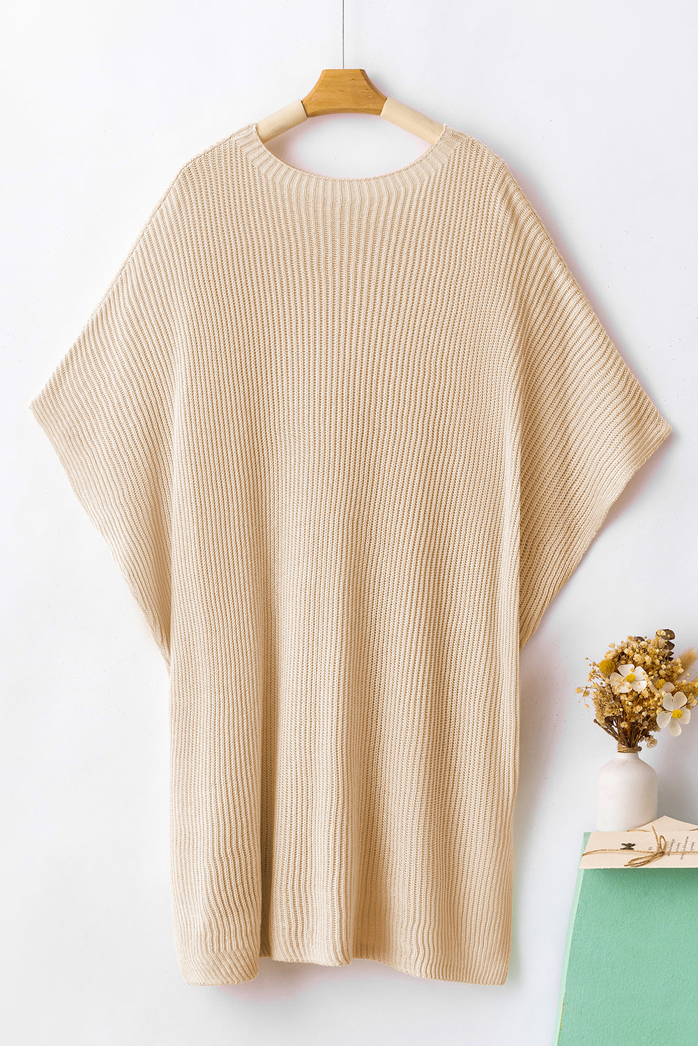 Apricot Side Slit Short Sleeve Oversized SweaterMaterial:55%Acrylic+45%Cotton



		The sweater is a comfortable and chic addition to your wardrobe. Made from breathable, lightweight, and stretchy knitted fabric,