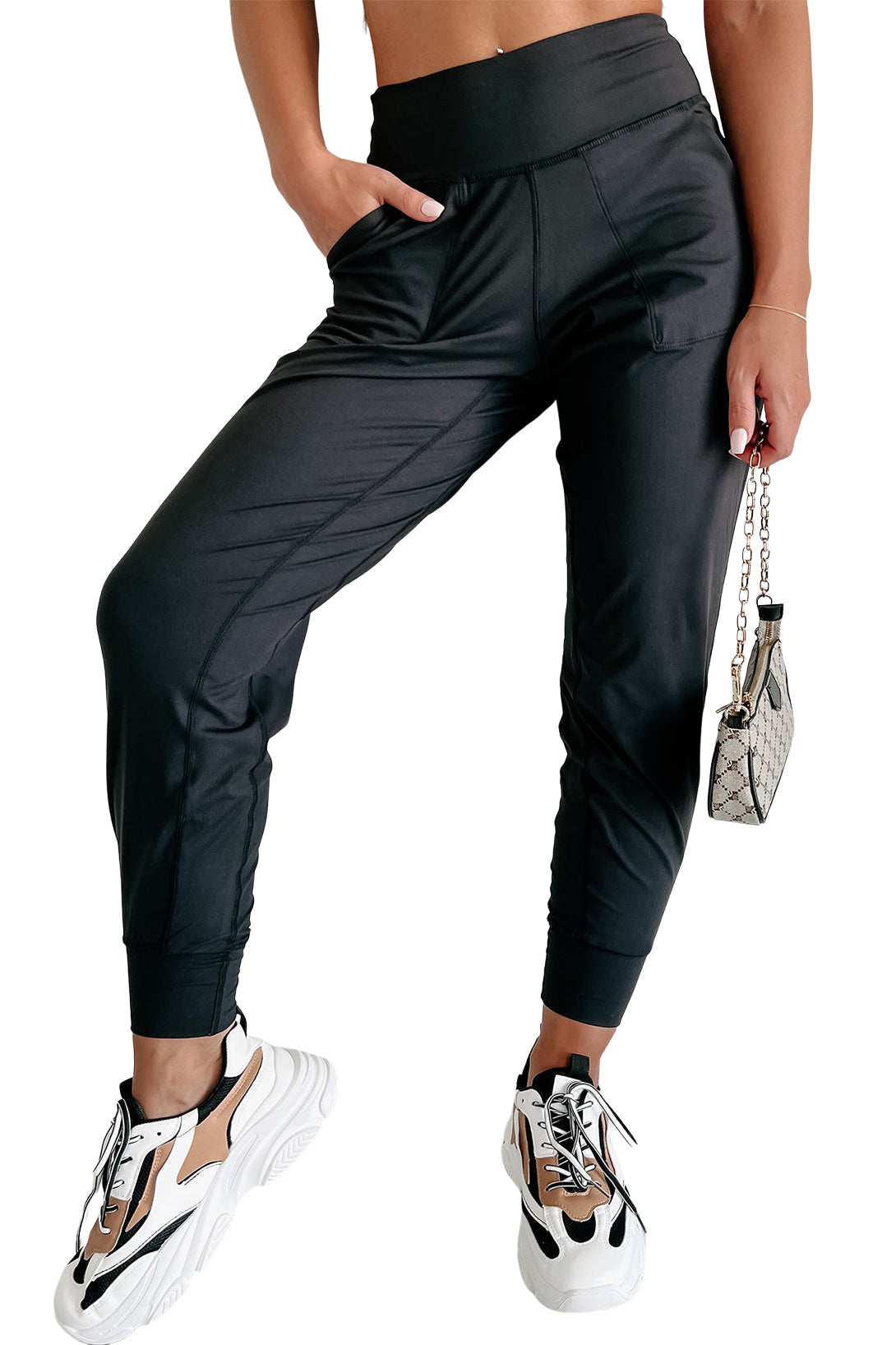 Black Exposed Seam High Waist Pocketed JoggersMaterial:100%Polyester



		These solid joggers are a versatile addition to your wardrobe, suitable for individuals of all body types.

	
		The exposed seam desi