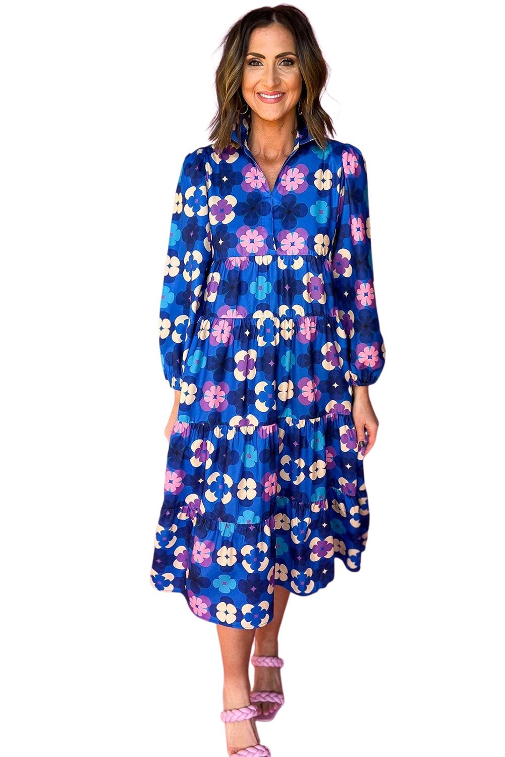 Blue Floral Peasant Sleeve Tiered Ruffle Midi DressMaterial:100%Polyester

• Embrace the charm of bohemian style with this midi dress, featuring a beautiful blue floral print that exudes effortless elegance.
• The 