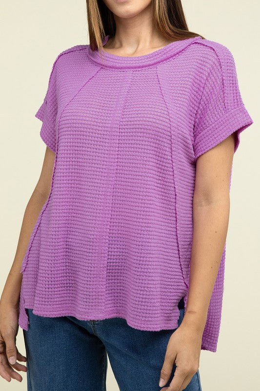 Brushed Waffle Exposed-Seam Short Sleeve TopElevate your casual wardrobe with this Brushed Waffle Top, featuring side slits, exposed seam details, and a stylish hi-low hem. Perfect for a relaxed yet trendy loo