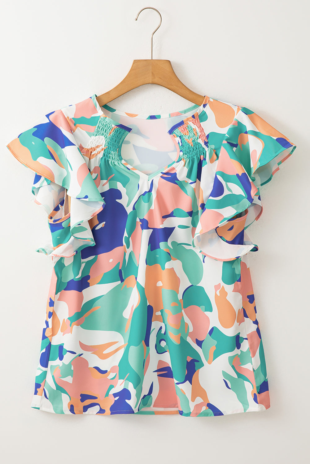 Green Abstract Print Smocked Notched Neck Ruffle Sleeve BlouseMaterial:100%Polyester

• Embrace a bohemian spirit with the blouse, featuring a vibrant green hue that adds a pop of color to any outfit.
• The abstract print des