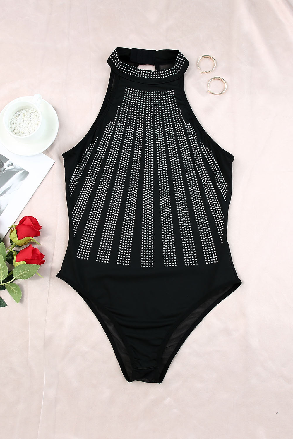 Black Sexy Rhinestone Sleeveless High Neck BodysuitMaterial:95%POLYESTER+5%ELASTANE


	

			The Black High Neck Sleeveless Diamante Bodysuit features a glamorous design that's perfect for a night out.
		
		
			