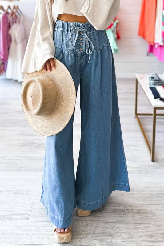 Dusk Blue Mineral Wash Button High Waist Wide Leg JeansMaterial:100%Cotton

• Crafted in a trendy mineral wash, these high waist wide leg jeans exude casual elegance, perfect for a laid-back yet stylish look.
• Featuri