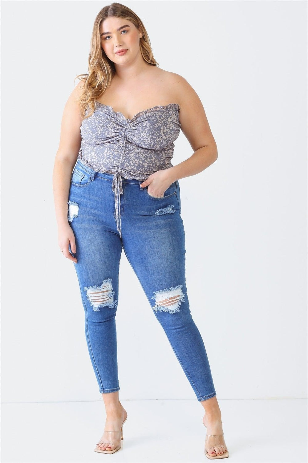 Zenobia Plus Size Drawstring Smocked Floral Tube TopThis drawstring smocked floral tube top is a feminine and summery addition to your wardrobe. The floral print adds a touch of freshness and charm, perfect for a casu