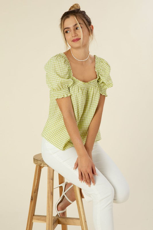 Smocked blouse with puff sleeve- Smocked blouse with puff sleeve- Pattern type : gingham check (yarn dyed)- Neck line : square neck- Sleeve type : puff sleeves- Sleeve length : short sleeves- Stre