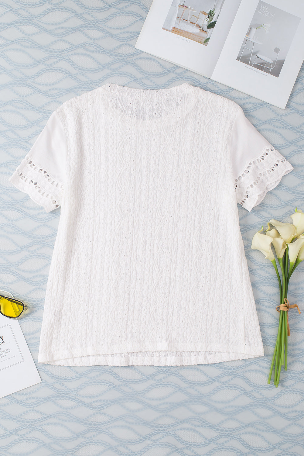 White Eyelet Embroidery Scalloped Short Sleeve BlouseMaterial:97%Polyester+3%Elastane



		The top features intricate details that add a touch of elegance to your look. 
	
	
		The scalloped trim enhances the femin