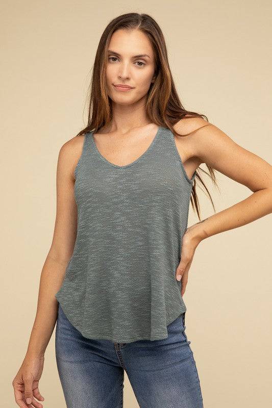 V Neck Sleeveless Cami TopThe V Neck Sleeveless Cami Top is a chic and versatile addition to any wardrobe. Featuring a flattering V neckline and a sleeveless design, this cami top is perfect 