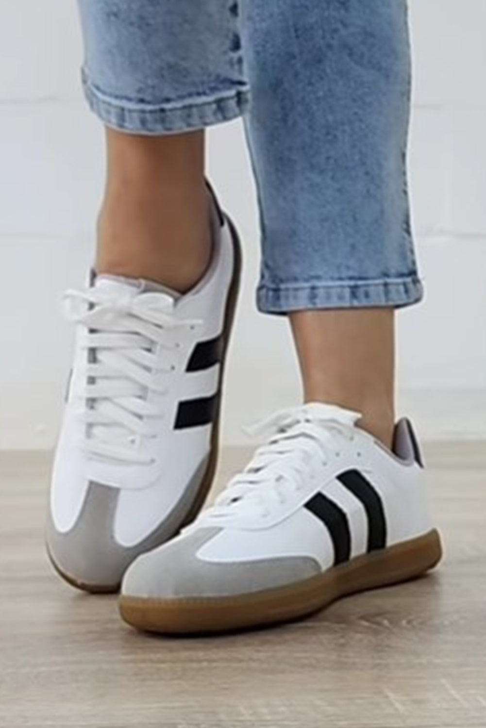 White Striped Lace Up Flat Sneakers• Stylish and versatile, these lace-up sneakers feature a chic white color with subtle stripes.
• Crafted with comfort in mind, the flat sole provides all-day suppo