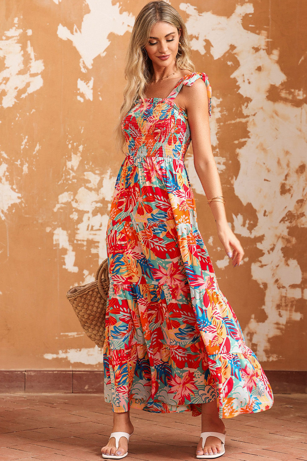 Multicolor Boho Tropical Print Smocked Ruffle Tiered Maxi DressMaterial:100%Polyester



		•The tiered design of the dress adds volume, creating a flowy and feminine look.
	
	
		•Smocked bodice and tie shoulder straps give 