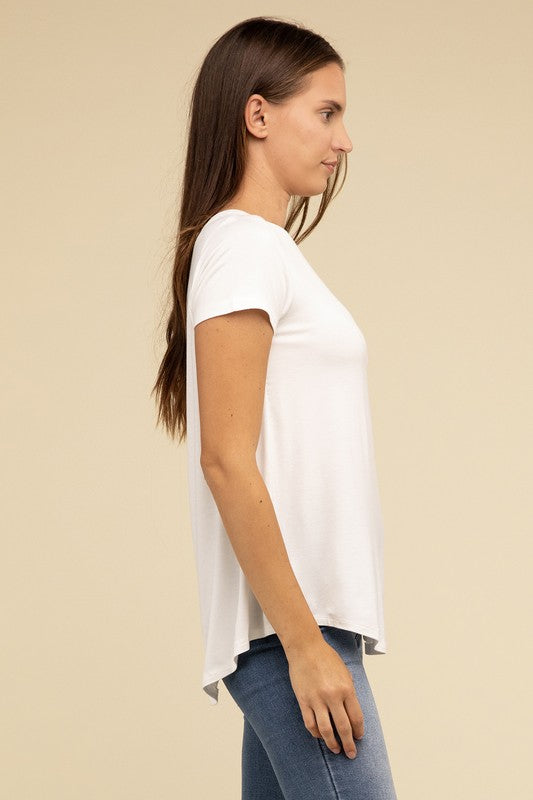 Flowy Round Hem Rayon Short Sleeve TopThe Flowy Round Hem Rayon Short Sleeve Top is the perfect addition to your casual wardrobe. Crafted from soft, lightweight rayon, this top features a relaxed fit and