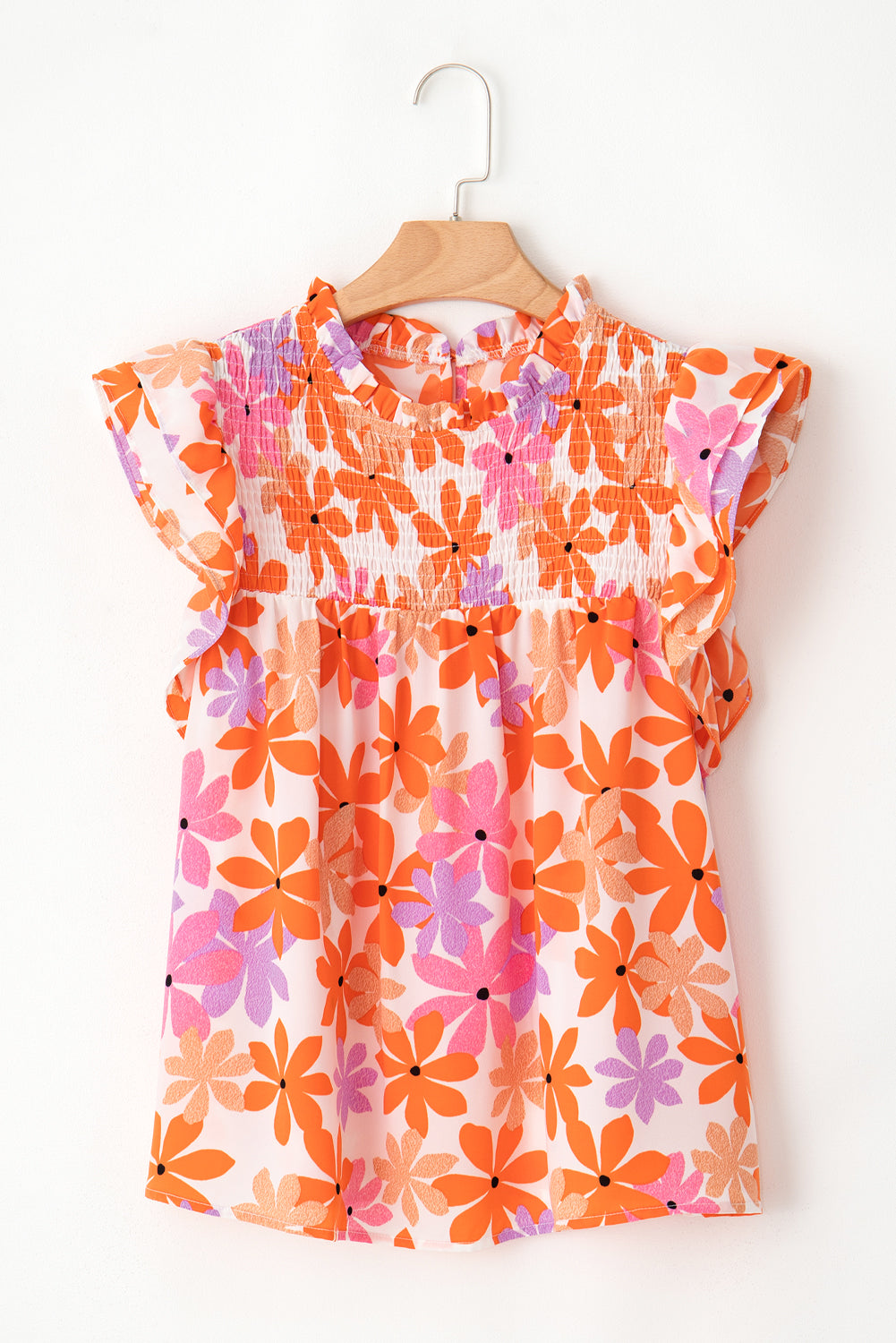 Orange Boho 60s Floral Print Ruffled Sleeve Smocked BlouseMaterial:100%Polyester



		Achieve a sweet and charming look with the floral blouse, designed to complement your style with a floral touch.
	
	
		The addition 