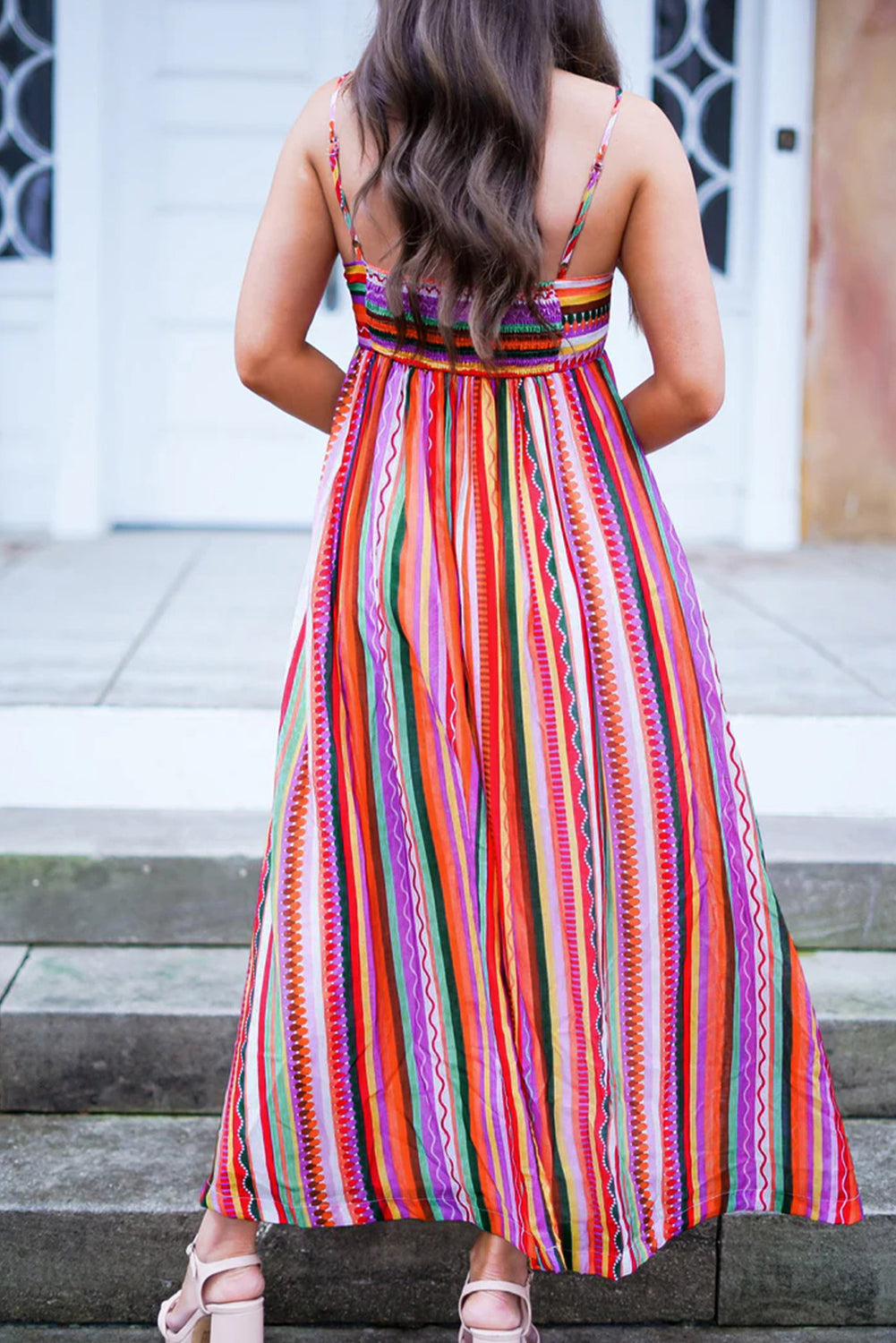 Multicolour Boho Striped Spaghetti Strap Smocked Back Maxi DressMaterial:100%Polyester

• Embrace a vibrant blend of colors in this maxi dress, perfect for daily wear with its relaxed, sleeveless design.
• The shirred back ensu