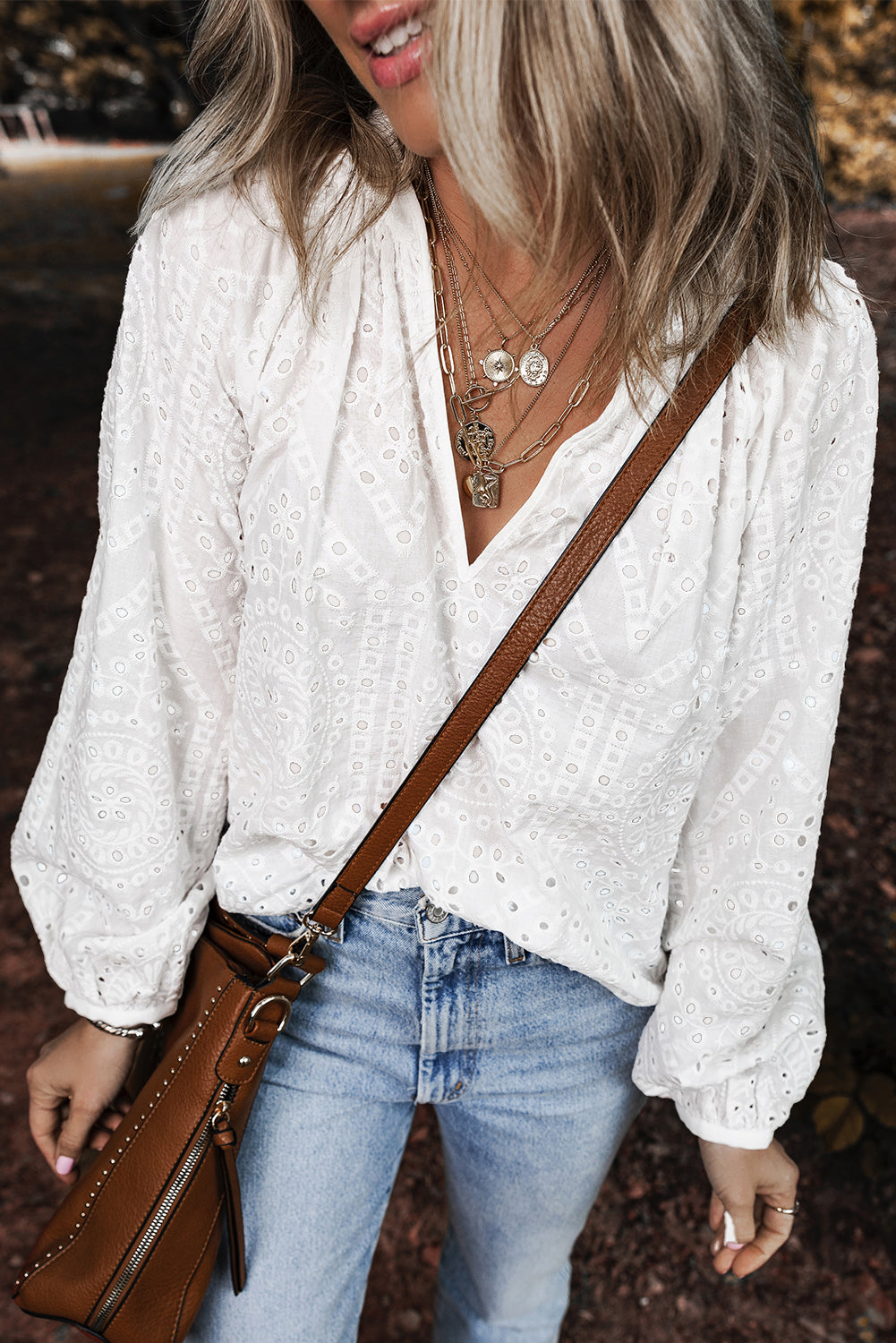 White Eyelet Embroidered V Neck Puff Sleeve BlouseMaterial:100%Cotton

• Delicate white eyelet embroidery adorns this charming blouse, adding a touch of elegance to your outfit. 
• The V-neck design creates a flat