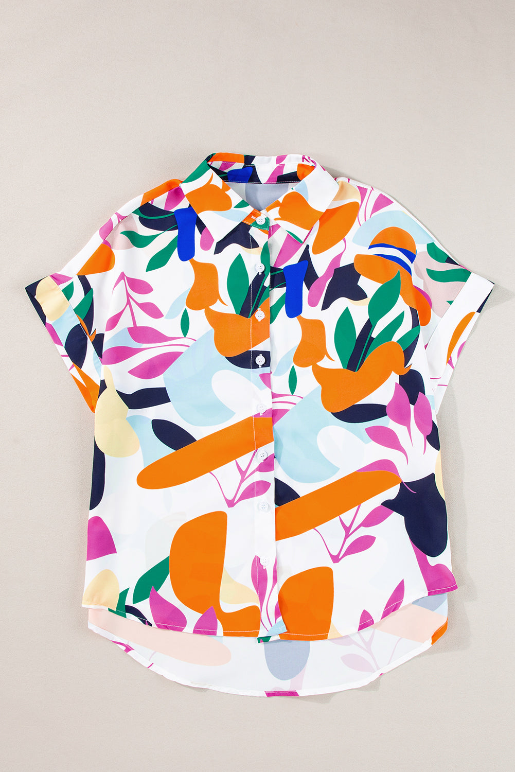 Multicolour Abstract Leaf Print Button Up Short Sleeve BlouseMaterial:100%Polyester

• Infuse your wardrobe with vibrancy in this blouse, perfect for a relaxed yet stylish look.
• The button-up design adds a touch of sophist