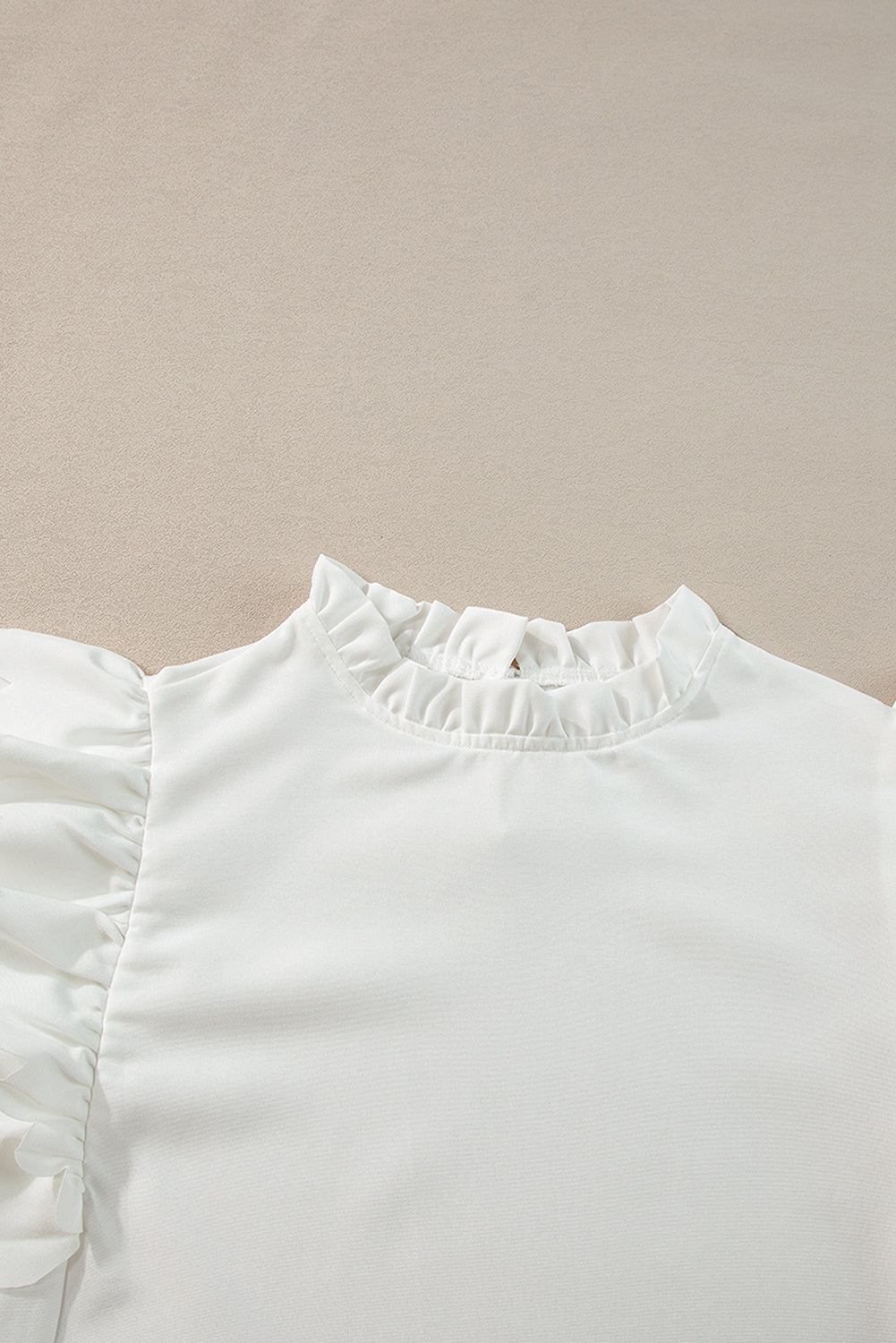 White Solid Color Scalloped Ruffle Sleeve BlouseMaterial:100%Polyester



		The blouse is a chic and feminine top featuring delicate scalloped edges and ruffle sleeves, adding a touch of elegance to your outfit.