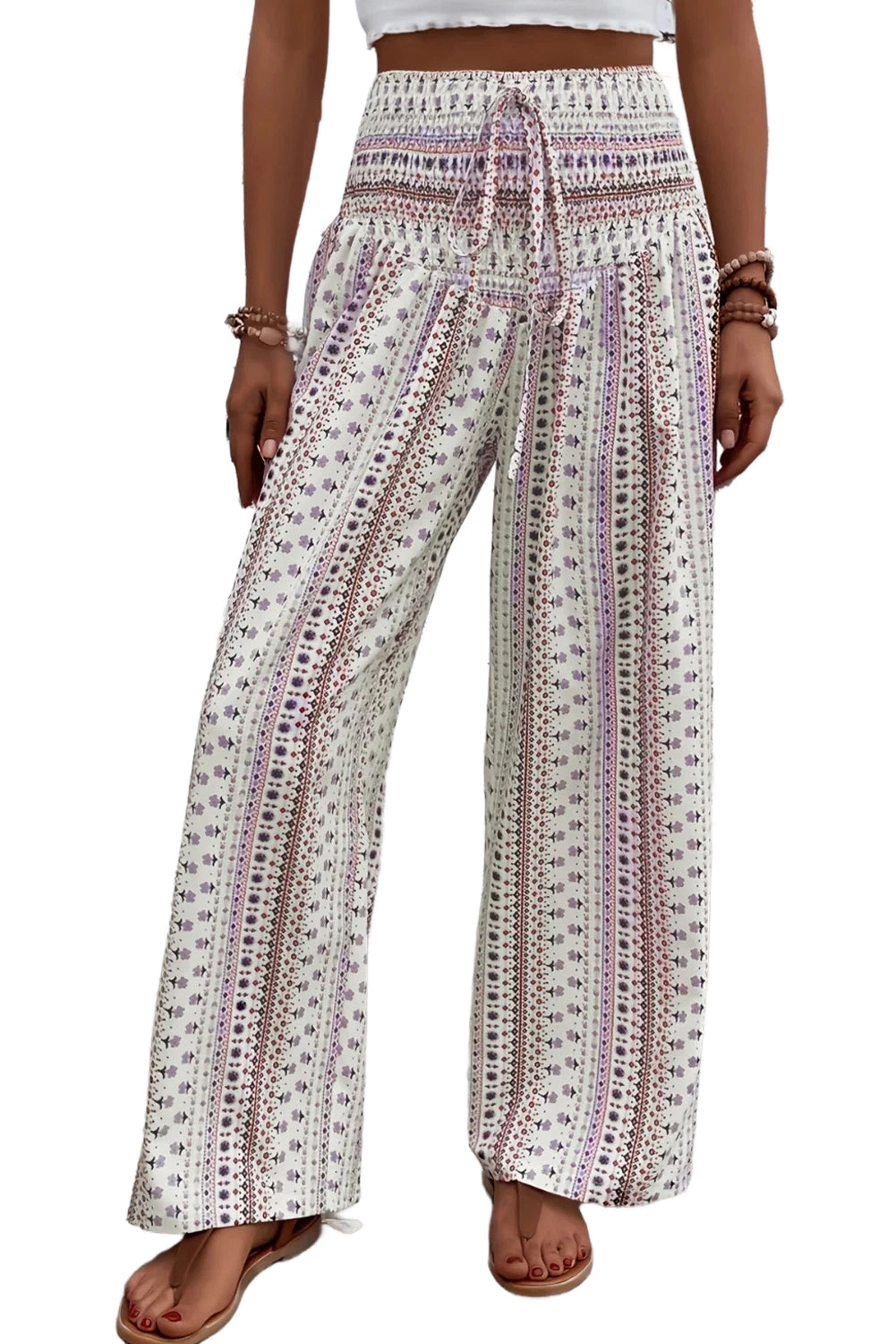 White Floral Print High Waist Drawstring Wide Leg Pants• The floral pattern adds a touch of femininity to any outfit, while the high waist and wide leg design ensure both comfort and style.
• The drawstring waist allows