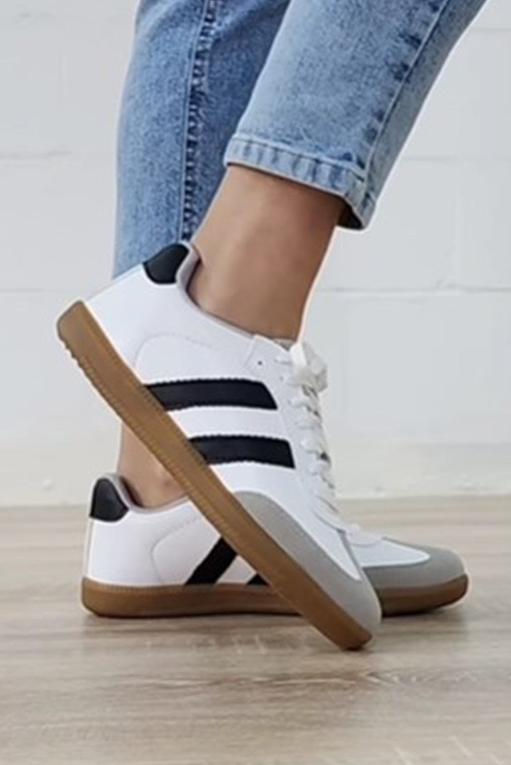 White Striped Lace Up Flat Sneakers• Stylish and versatile, these lace-up sneakers feature a chic white color with subtle stripes.
• Crafted with comfort in mind, the flat sole provides all-day suppo