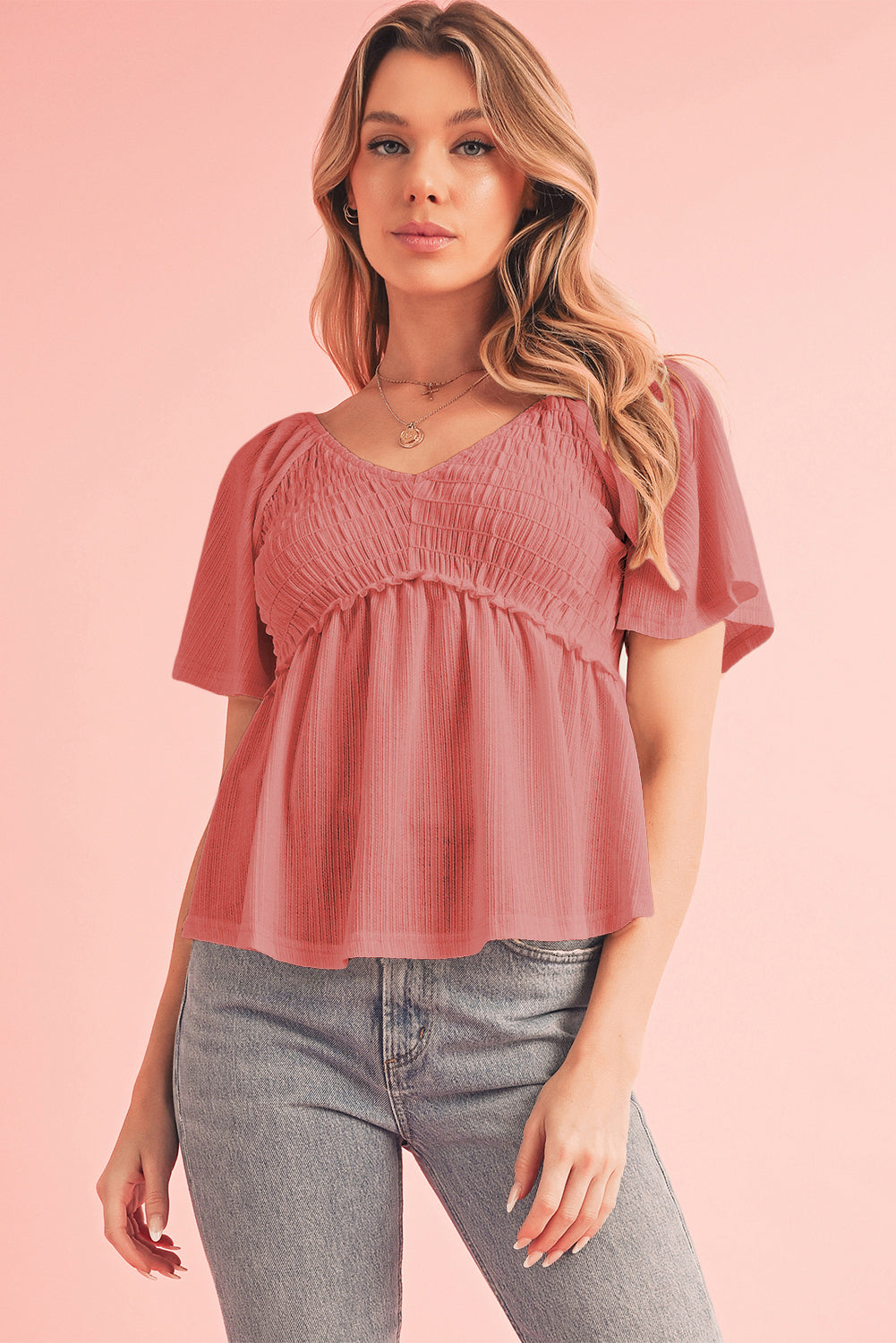 Tomato Red Shirred V Neck Short Flutter Sleeve Textured BlouseMaterial:95%POLYESTER+5%ELASTANE



		The blouse is a charming and feminine top featuring a shirred V-neckline and delicate flutter sleeves, adding a touch of eleg