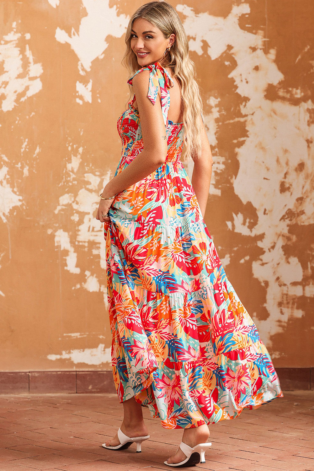 Multicolor Boho Tropical Print Smocked Ruffle Tiered Maxi DressMaterial:100%Polyester



		•The tiered design of the dress adds volume, creating a flowy and feminine look.
	
	
		•Smocked bodice and tie shoulder straps give 