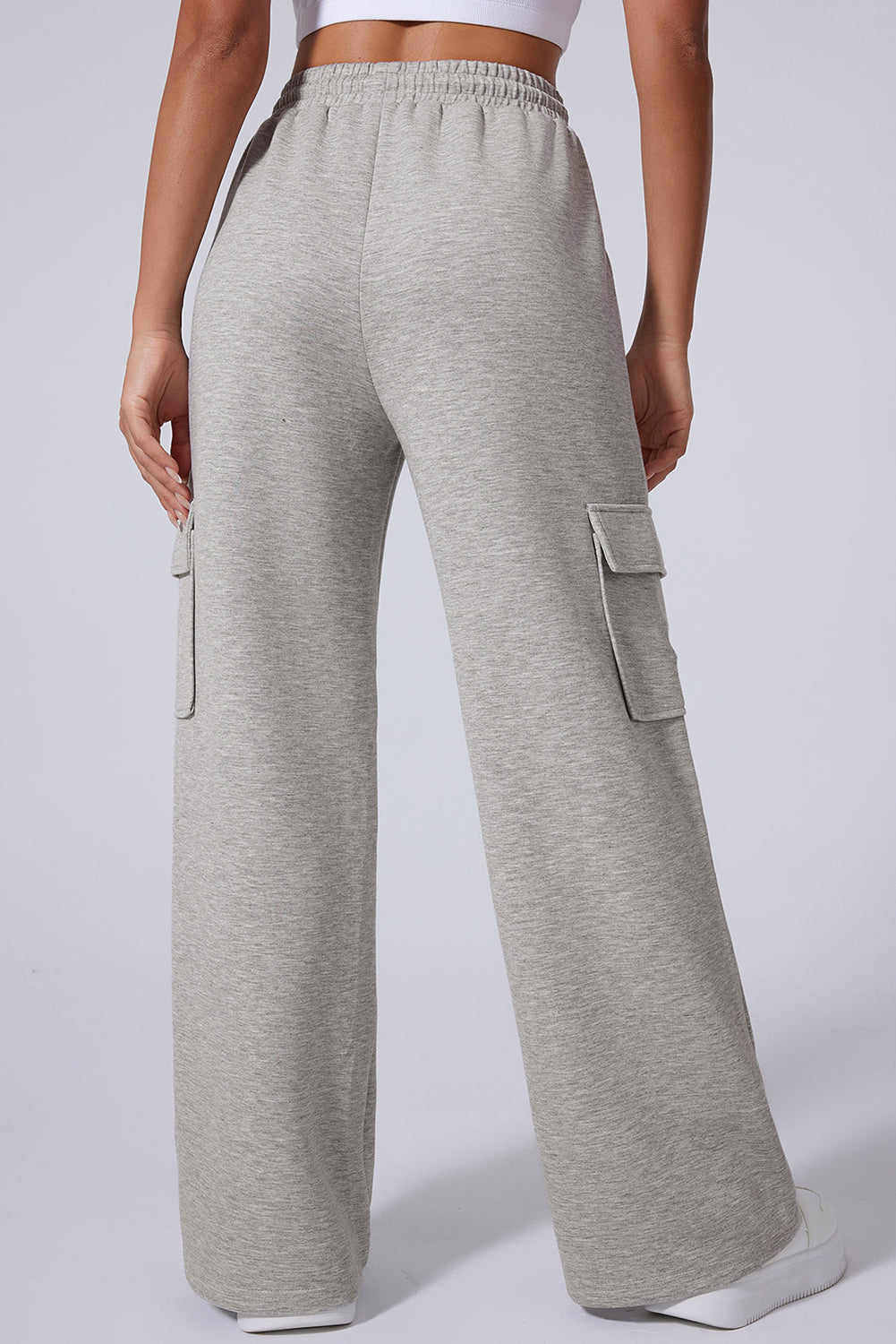 Light Grey Multi Pockets Lace Up High Waist Wide Leg Workout PantsMaterial:50%Polyester+45%Viscose+5%Elastane

• Crafted in a trendy light grey hue, these workout pants feature a lace-up design at the waist for a secure fit during