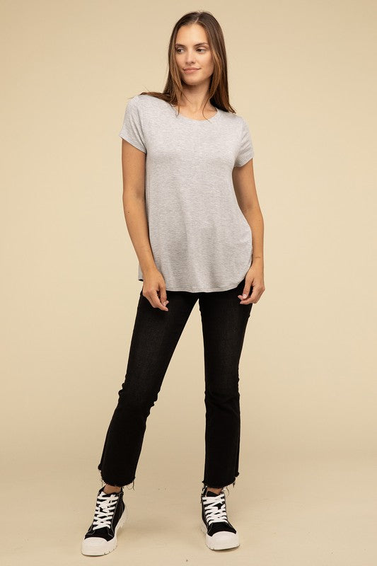 Flowy Round Hem Rayon Short Sleeve TopThe Flowy Round Hem Rayon Short Sleeve Top is the perfect addition to your casual wardrobe. Crafted from soft, lightweight rayon, this top features a relaxed fit and