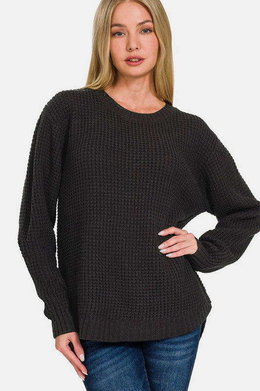 Zenana High Low Long Sleeve Waffle SweaterStay cozy and chic in this High Low Long Sleeve Waffle Sweater. With its unique waffle texture and flattering high-low hemline, this sweater is perfect for casual da