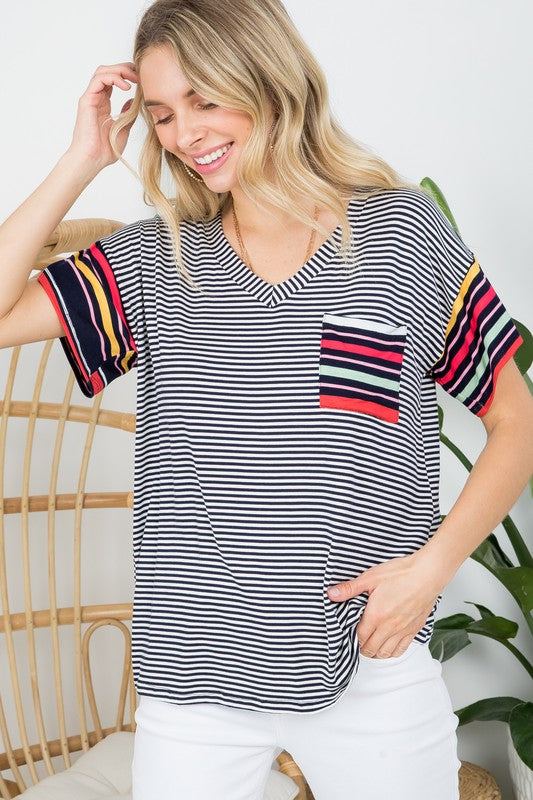 MULTI STRIPE BOXY TOP- Multi stripe boxy top- Pullover short sleeves- V neck chest pocket- Multi stripe jersey - Model is 5' 8" 34-24-34 and wearing a Small- S/M/L 2-2-2- 95% RAYON, 5% S