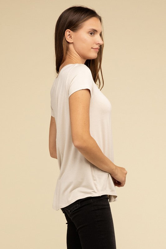 Flowy Round Hem Rayon Short Sleeve TopThe Flowy Round Hem Rayon Short Sleeve Top is the perfect addition to your casual wardrobe. Crafted from soft, lightweight rayon, this top features a relaxed fit and