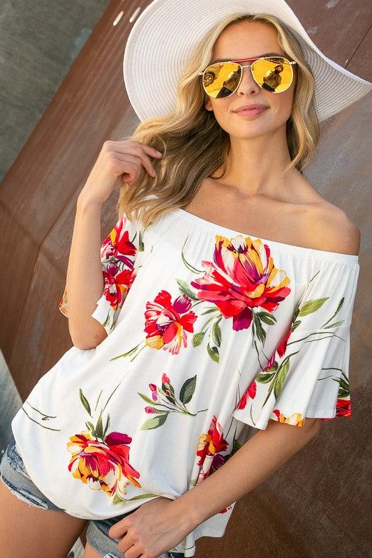 FLORAL OFF SHOULDER TOPFLORAL PRINT JERSEY ELASTICIZED OFF SHOULDER TOP- Floral off shoulder top- Elasticized off shoulder neckline- Ruffle short sleeves- Loose fit- Allover floral print j