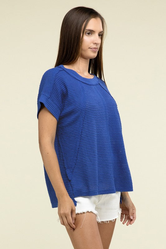 Brushed Waffle Exposed-Seam Short Sleeve TopElevate your casual wardrobe with this Brushed Waffle Top, featuring side slits, exposed seam details, and a stylish hi-low hem. Perfect for a relaxed yet trendy loo