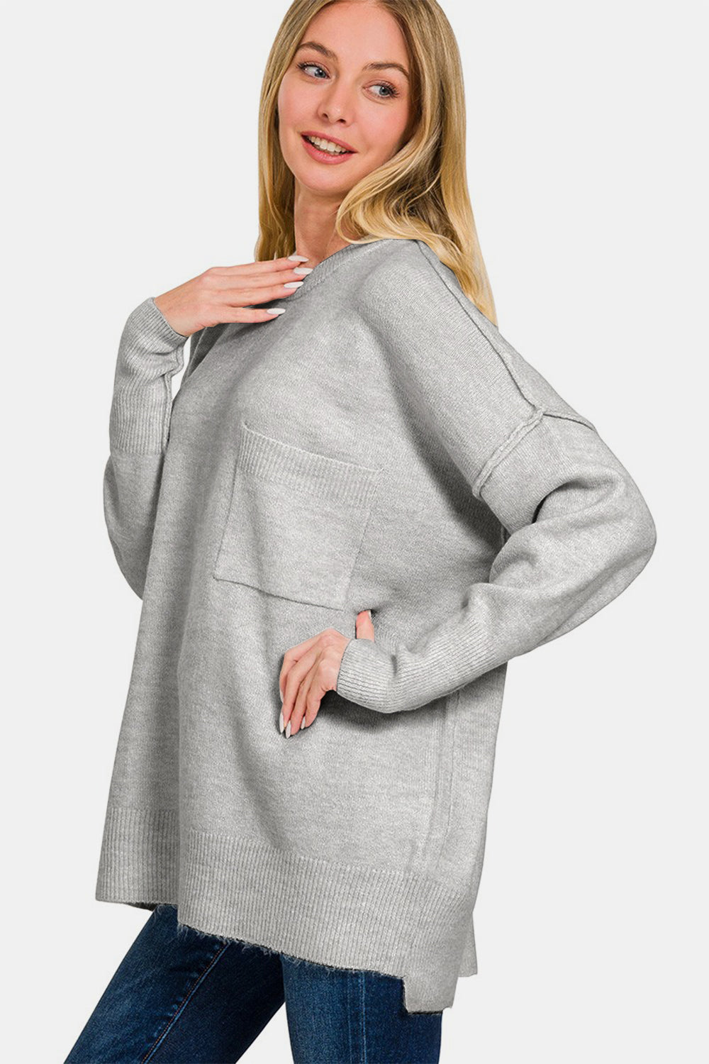 Zenana High-Low Hem Drop Shoulder SweaterThis hi-low hem pocket sweater is crafted from soft and midweight material, making it both cozy and comfortable for everyday wear. The hi-low hem adds a trendy touch