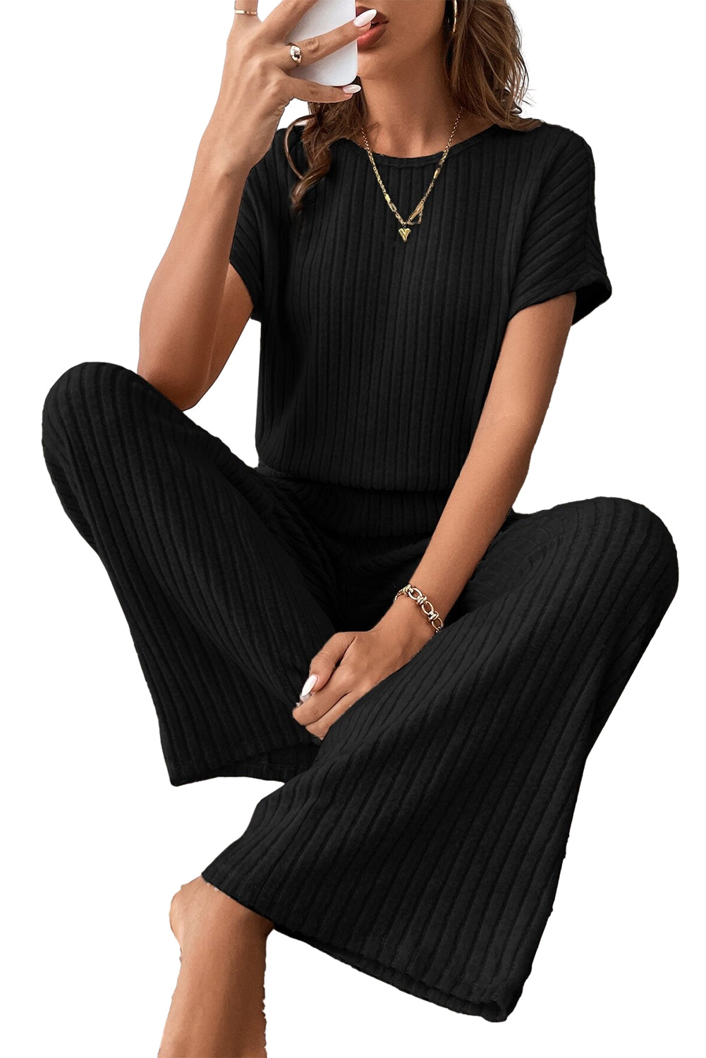 Grass Green Solid Color Ribbed Short Sleeve Wide Leg JumpsuitMaterial:85%Polyester+10%Viscose+5%Elastane



		The jumpsuit is a versatile and trendy one-piece outfit, featuring a solid color design that offers a sleek and mi