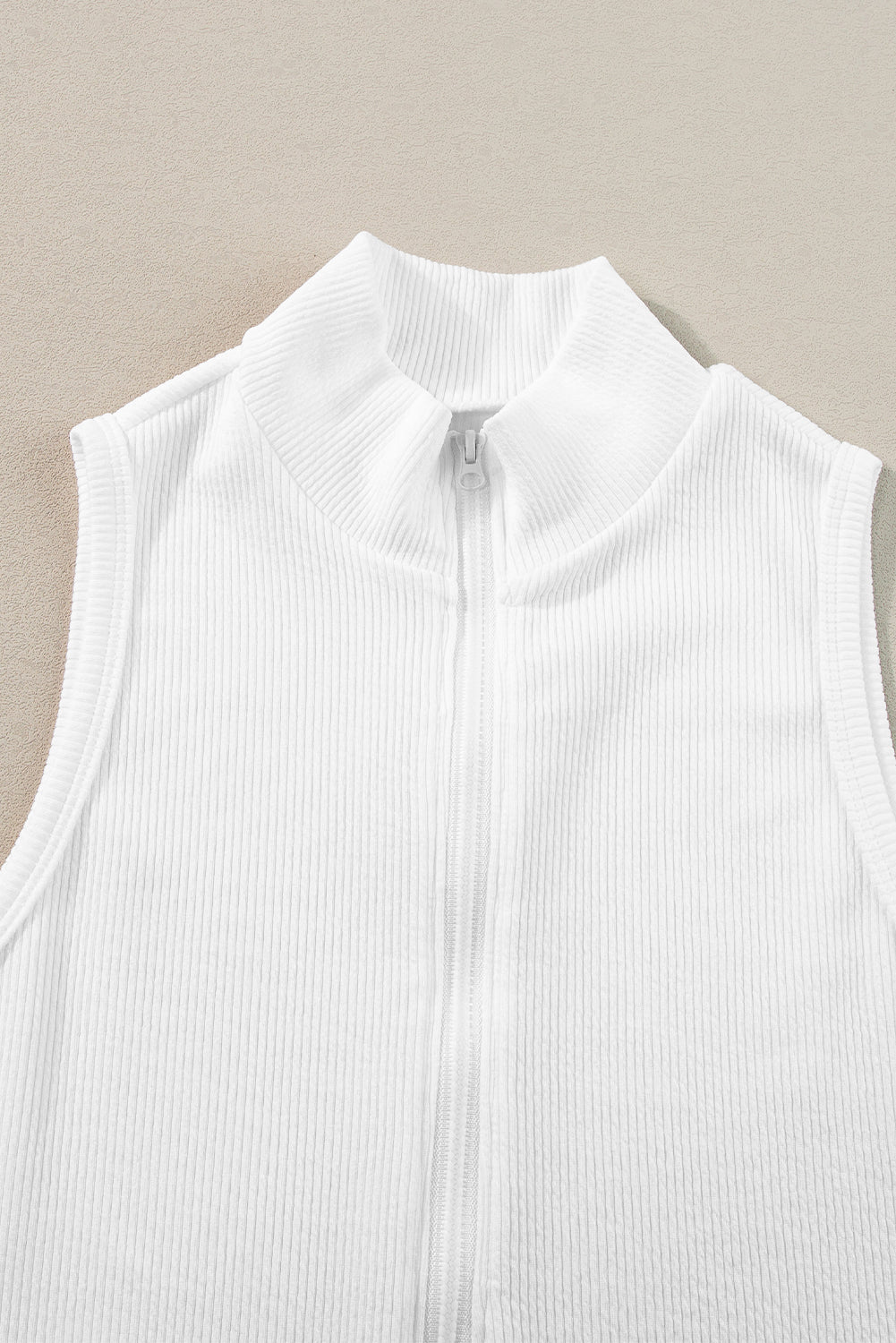 White Zip Up Mock Neck Ribbed Sleeveless BodysuitMaterial:95%Polyester+5%Elastane



		The zip-up feature of this chic bodysuit provides convenient on and off access. 
	
	
		Adding a touch of sophistication an