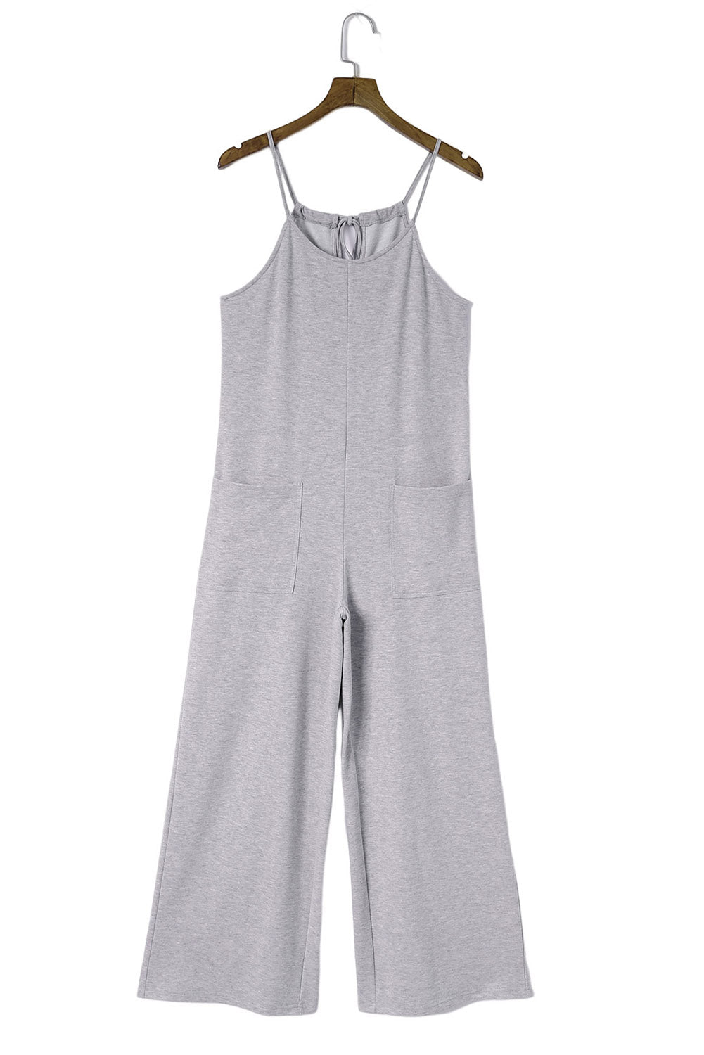 Gray Loose Fit Side Pockets Spaghetti Strap Wide Leg JumpsuitMaterial:65%Polyester+30%Cotton+5%Elastane



		Featuring a loose fit, the wide leg
jumpsuit provides freedom of movement
	
	
		Spaghetti straps highlight wome