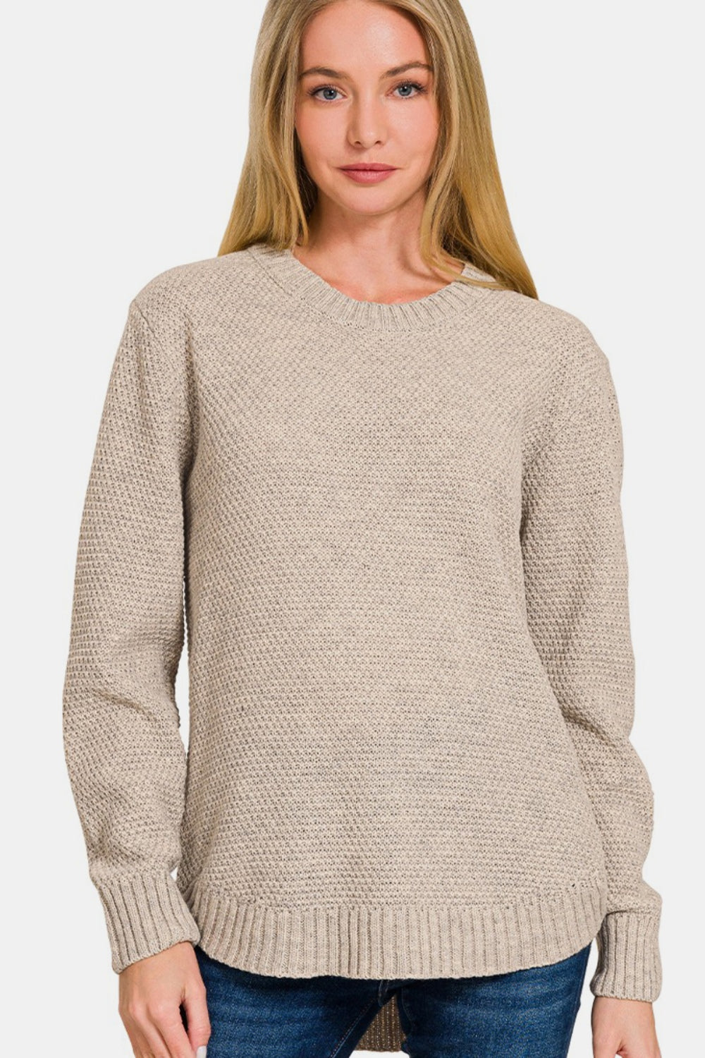 Zenana Ful Size Round Neck Long Sleeve Curved Hem SweaterThe round neck long sleeve curved hem sweater offers a timeless and versatile option for your winter wardrobe. With its classic round neckline and long sleeves, it p