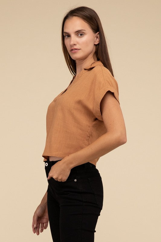 Always a Delight Short Sleeve Linen TopExperience everyday elegance with our Always a Delight Short Sleeve Linen Top. This top exudes understated sophistication with its collared V-neck and cuffed short s