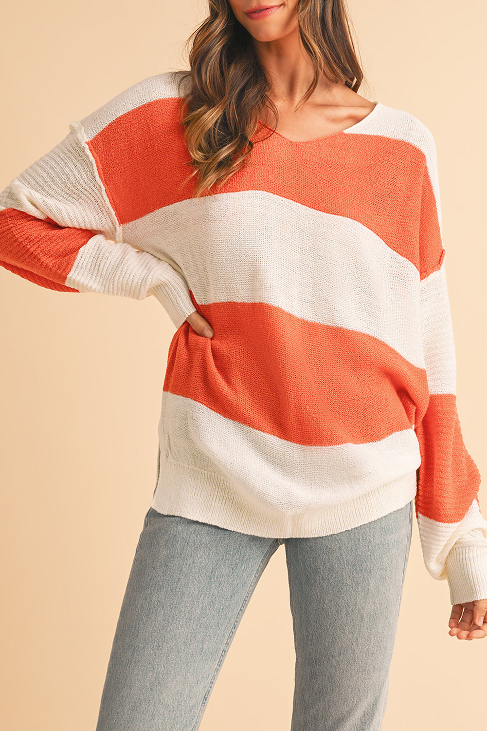 Orange Colorblock V Neck Side Slits SweaterMaterial:100%Acrylic

• Stand out in style with our sweater, blending casual stripes with a trendy rib-knit design.
• The vibrant orange hues add a pop of color to