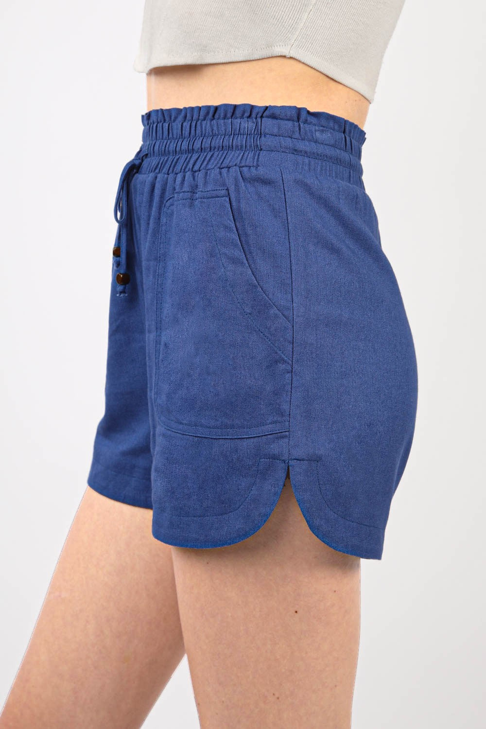 VERY J Drawstring Elastic Waist Linen ShortsStay cool and comfortable in these Elastic Waist Solid Linen Shorts featuring side pockets and a round hem for added style. These Cool Comfort Eco-Friendly Recycling