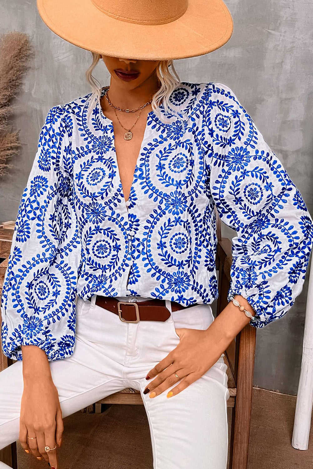 Sky Blue Embroidered V Neck Puff Sleeve Boho BlouseMaterial:100%Polyester

• Exude bohemian charm with this blouse featuring intricate floral embroidery and delicate puff sleeves. Perfect for a whimsical and romanti