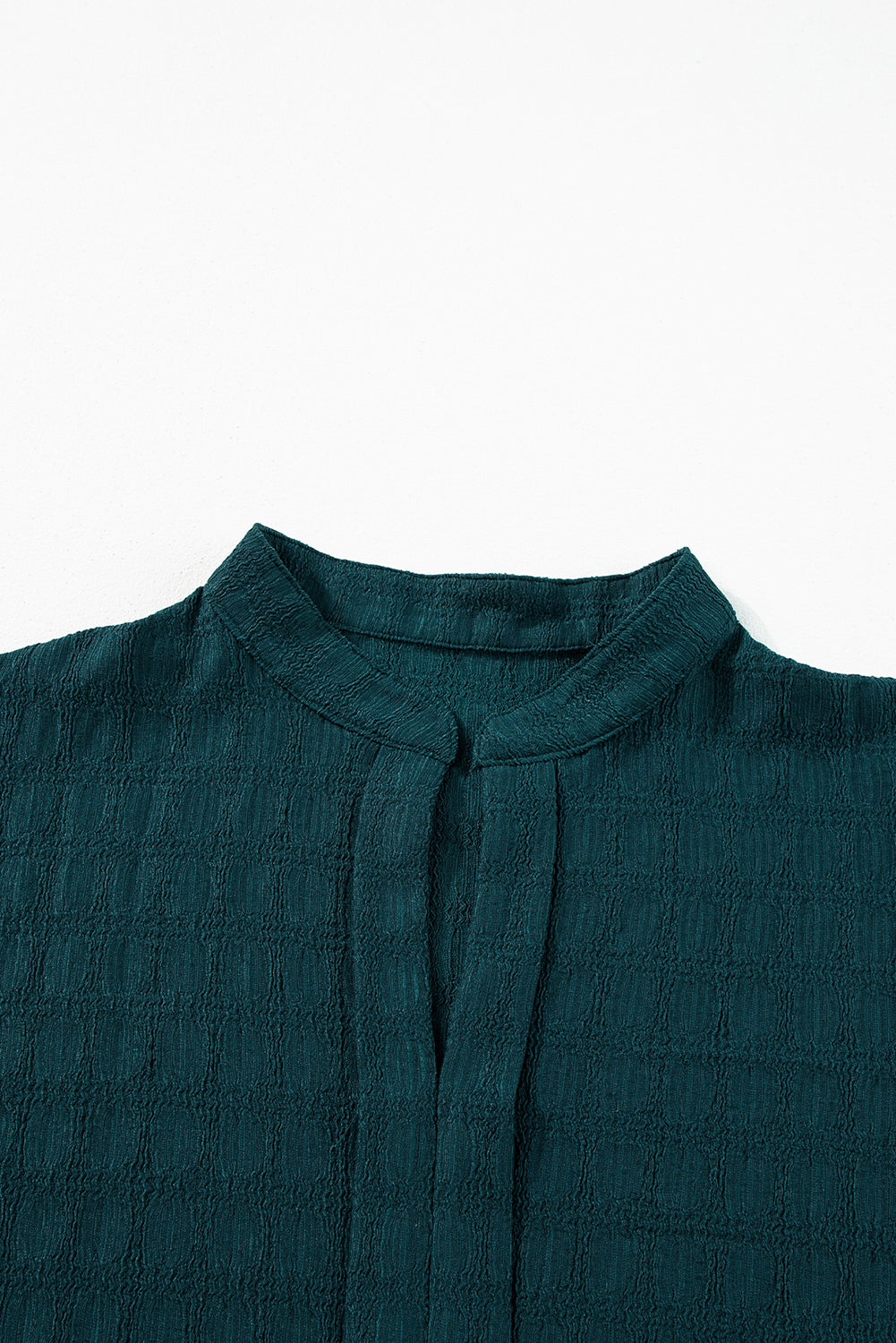 Sea Green Textured Split V-Neck Short Sleeve BlouseWith its flattering split V-neckline, this blouse adds a touch of elegance and sophistication to any outfit.
	
	
		The short sleeves provide a comfortable and bre