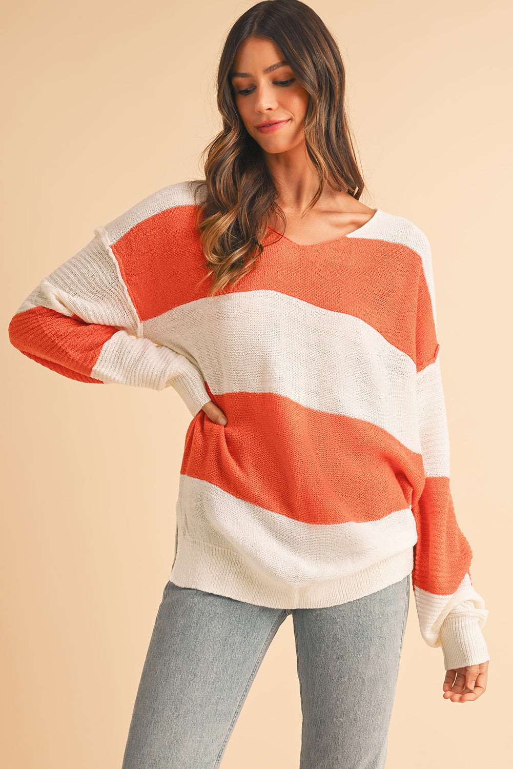 Orange Colorblock V Neck Side Slits SweaterMaterial:100%Acrylic

• Stand out in style with our sweater, blending casual stripes with a trendy rib-knit design.
• The vibrant orange hues add a pop of color to