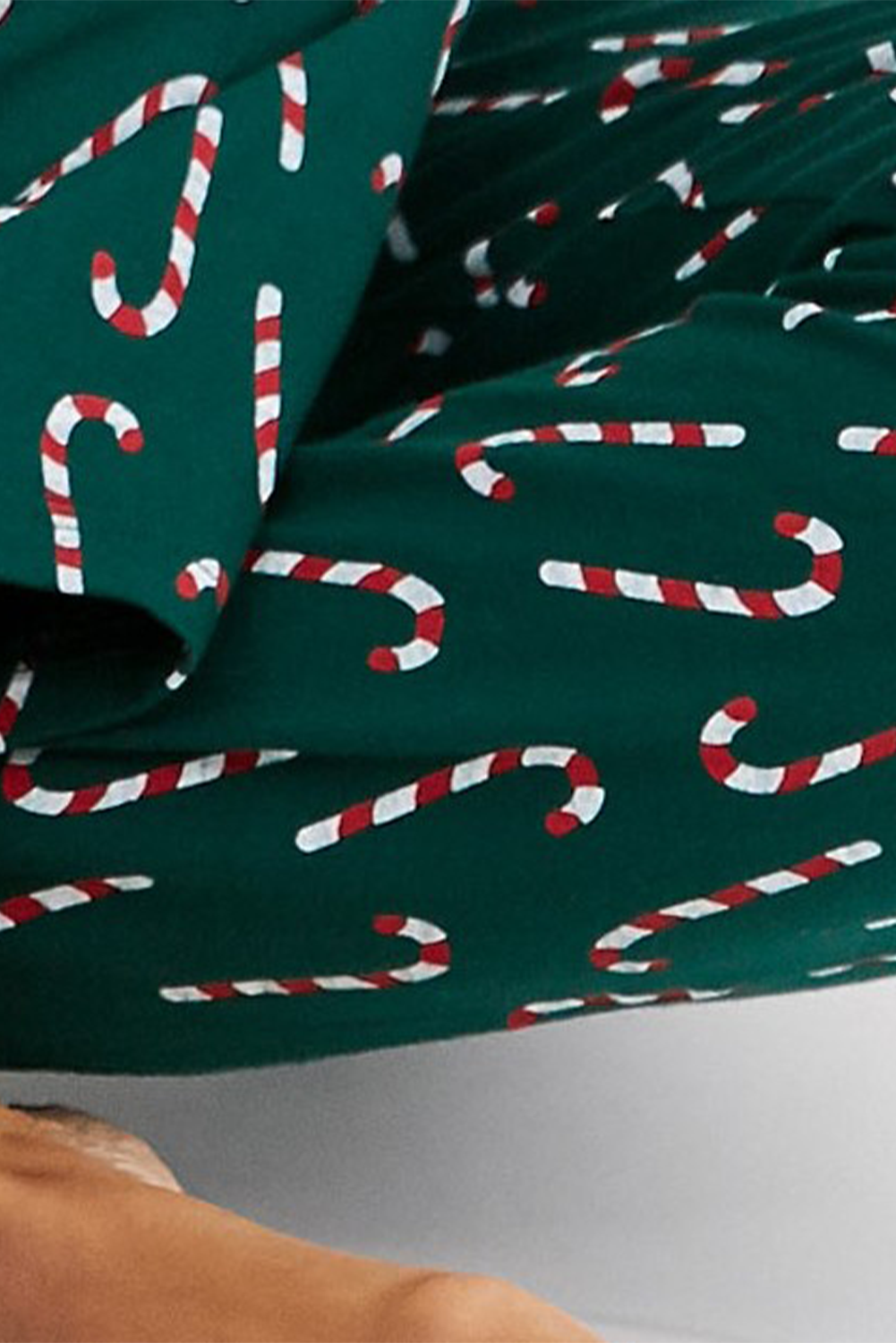 Green Christmas Candy Cane Printed Top and Pants Loungewear SetMaterial:95%Polyester+5%Elastane

• Festive green color brings a touch of holiday spirit to your loungewear collection. 
• Unique candy cane print adds a fun and p