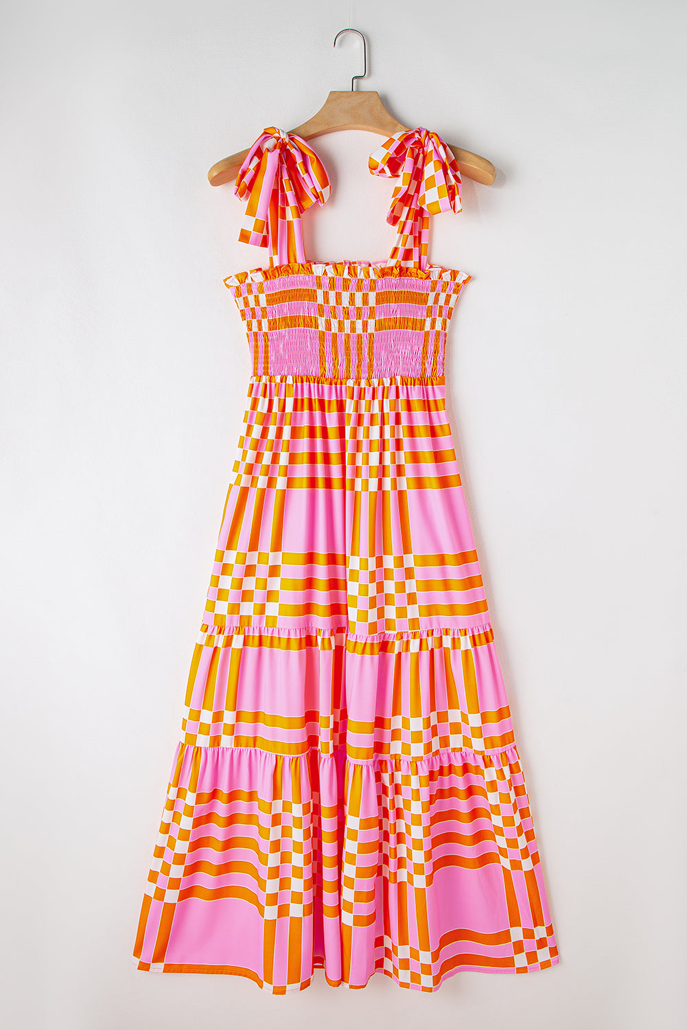 Pink Tie Strap Plaid & Striped Smocked Maxi DressMaterial:100%Polyester



		Embrace the sunshine with this flowy long dress
	
	
		It’s a elegantly flared dress with tiered skirt and self-tie straps
	
	
		F