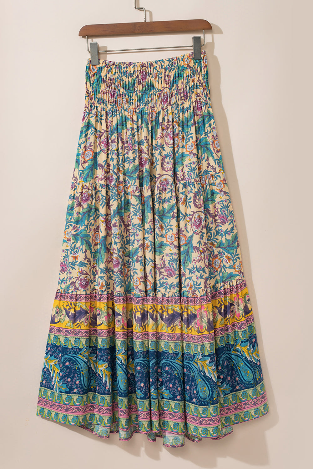 Sky Blue Boho Floral & Paisley Print Shirred Waist Long SkirtMaterial:100%Viscose

• Embrace a bohemian flair with this skirt, featuring a shirred waist that accentuates the natural curves for a flattering fit.
• The intrica