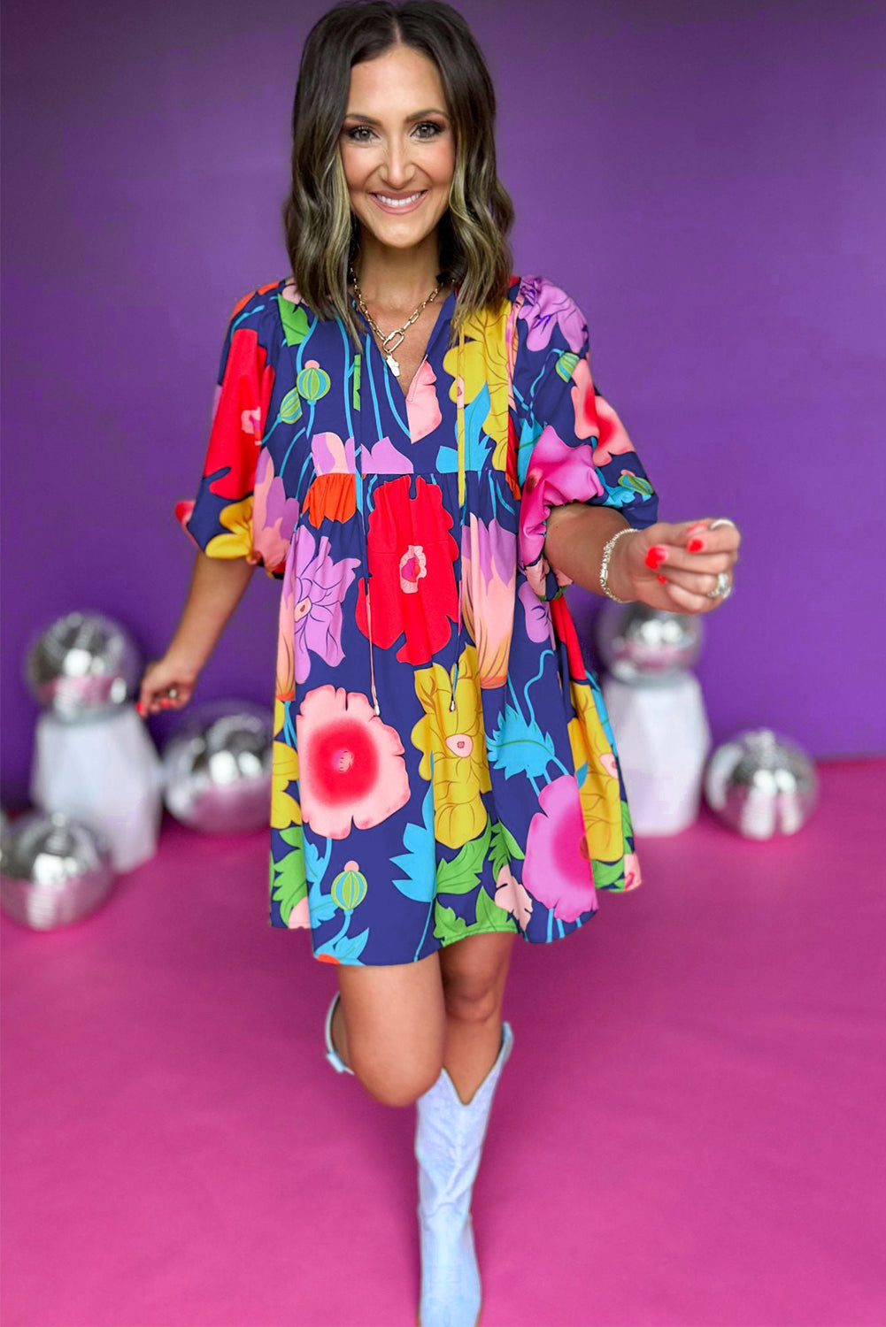 White Puff Sleeve Tied Split Neck Colorful Floral Flowy DressMaterial:100%Cotton


	


		Step into elegance with our mini dress, a vibrant and feminine piece designed to make a statement.
	
	
		This dress features charm