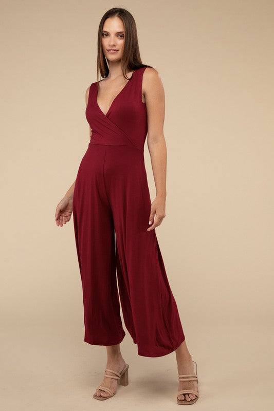 Surplice Neckline Sleeveless JumpsuitThe Surplice Neckline Sleeveless Jumpsuit exudes effortless elegance and modern sophistication. Featuring a surplice neckline, this jumpsuit offers a chic and flatte