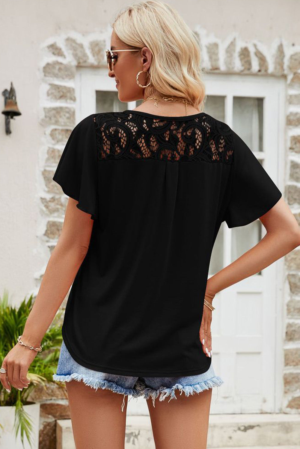 Black Cut Out Lace Patchwork Flutter Sleeve Blouse• Elegant black lace detailing adds a touch of sophistication to this patchwork cut-out shirt, perfect for a stylish day-to-night look.
• The flutter sleeves create