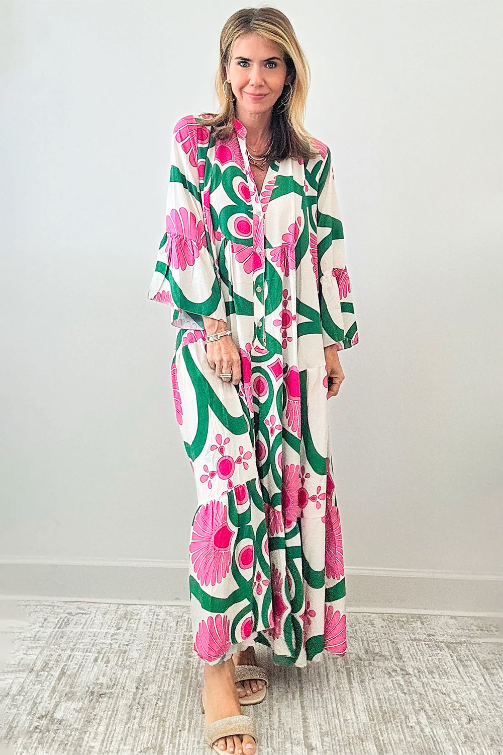 Pink Boho Abstract Button V Neck Oversized Maxi DressMaterial:100%Polyester

• Embrace your inner free spirit with our maxi dress, featuring a stunning abstract pattern and bell sleeves that exude bohemian charm. 
• 