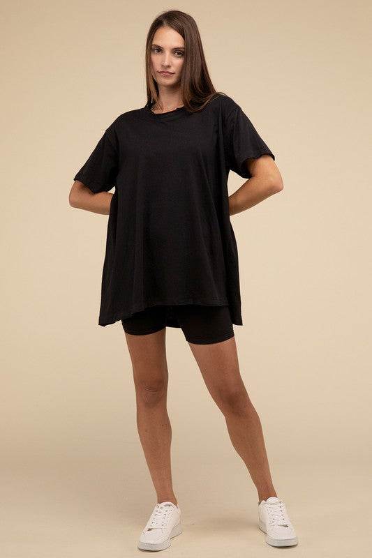 Cotton Drop Shoulder Oversized TopThe Cotton Drop Shoulder Oversized Top is a chic and comfortable addition to your wardrobe. With raw edge details adding a touch of edge, this top offers a relaxed, 